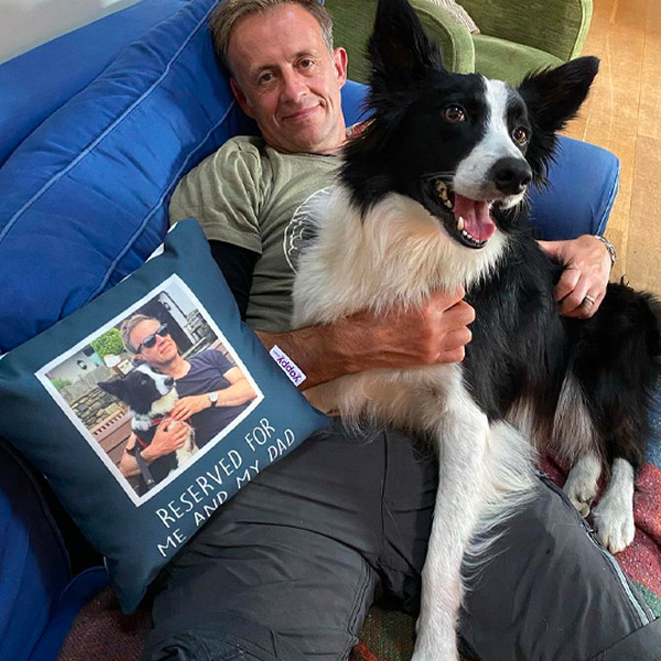 border collie and dog dad on a sofa with his fathers day personalised photo upload cushion 