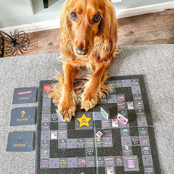 Rhea posing with her Personalised Board Game